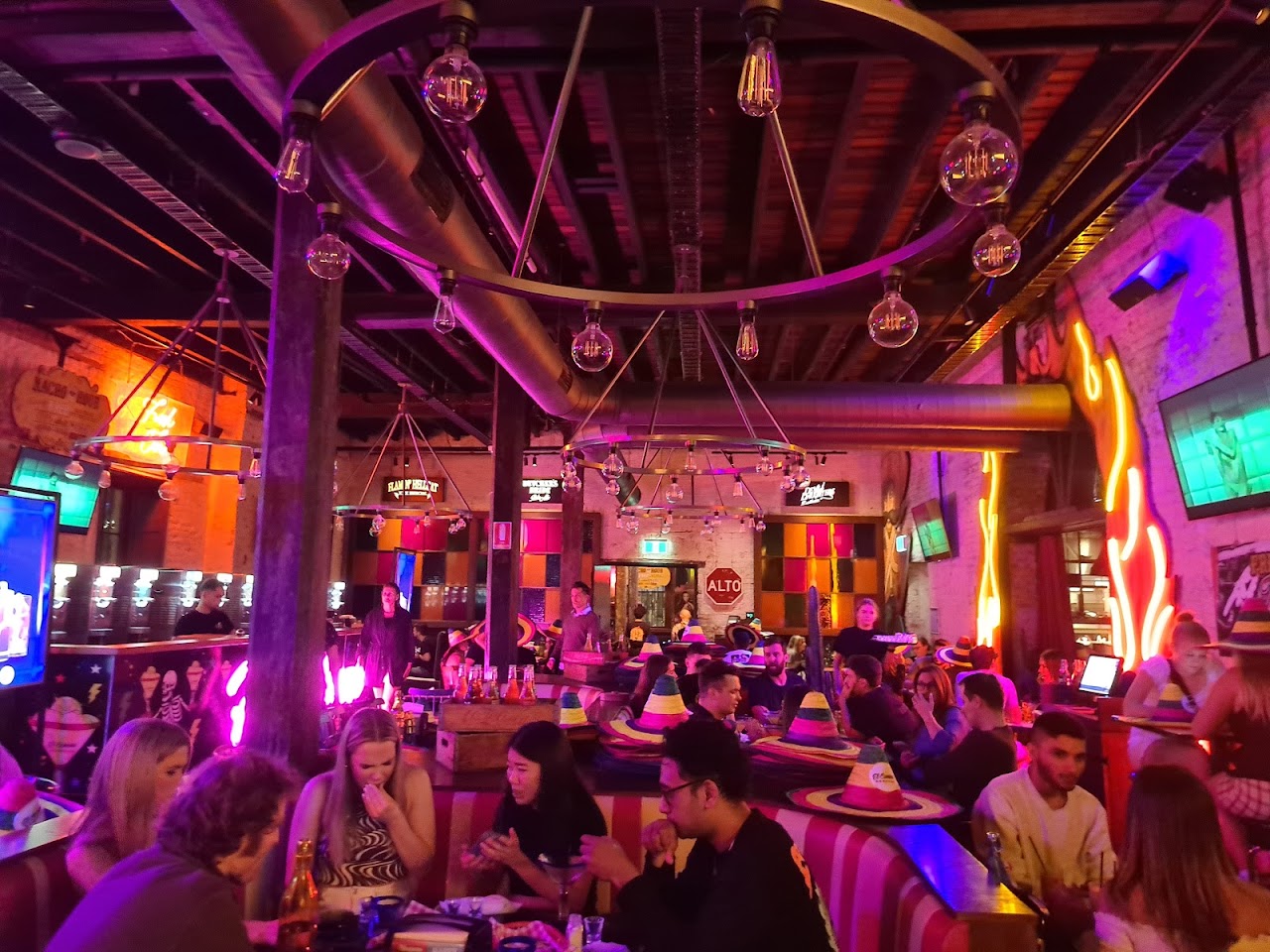 Neon-lit dining room at El Camino Cantina The Rocks